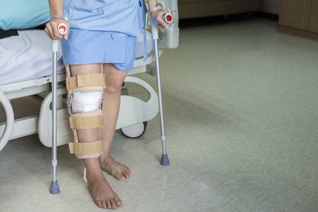 Rigid knee brace, dressing and stitch removal